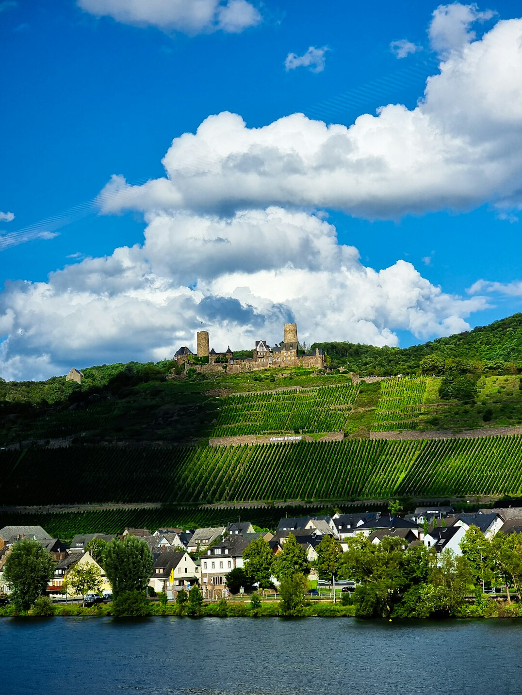 Reichsburg Cochem castle rising above the town on the Moselle